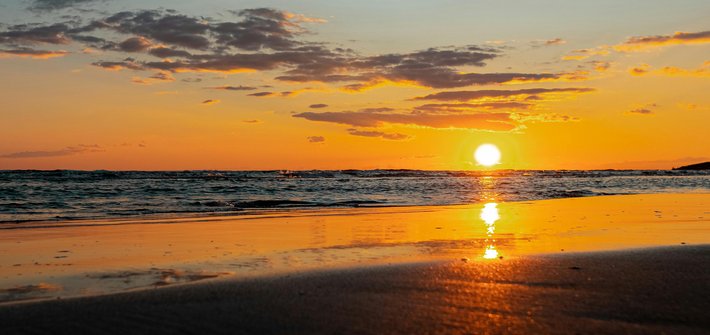 A sunset in the distance over the ocean