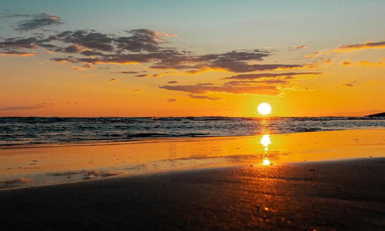 A sunset in the distance over the ocean