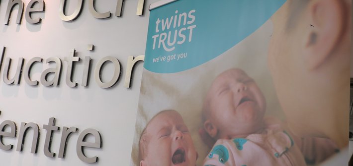 A Twins Trust banner is seen in front of a UCH Education Centre sign