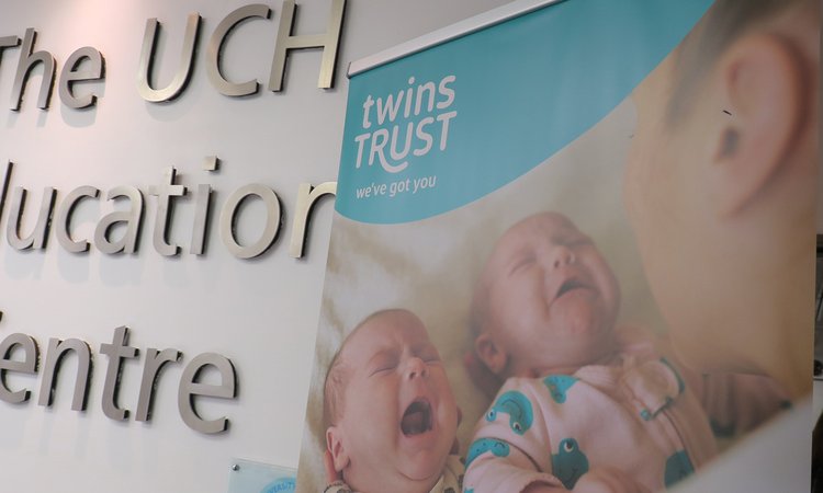 A Twins Trust banner is seen in front of a UCH Education Centre sign