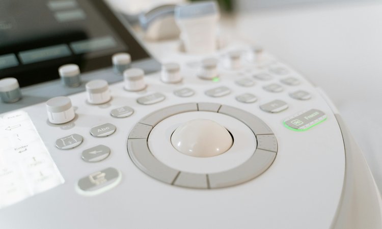 A close up image of the controls on a sonography machine
