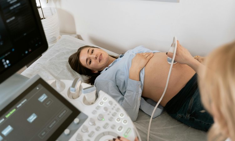 A pregnant woman being given an ultrasound scan
