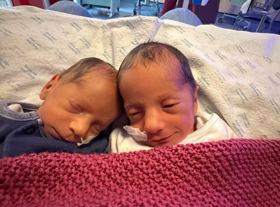 Newborn twin babies sleeping together