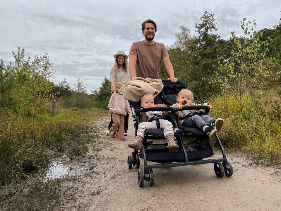 Young family having a holiday walk in the heath
