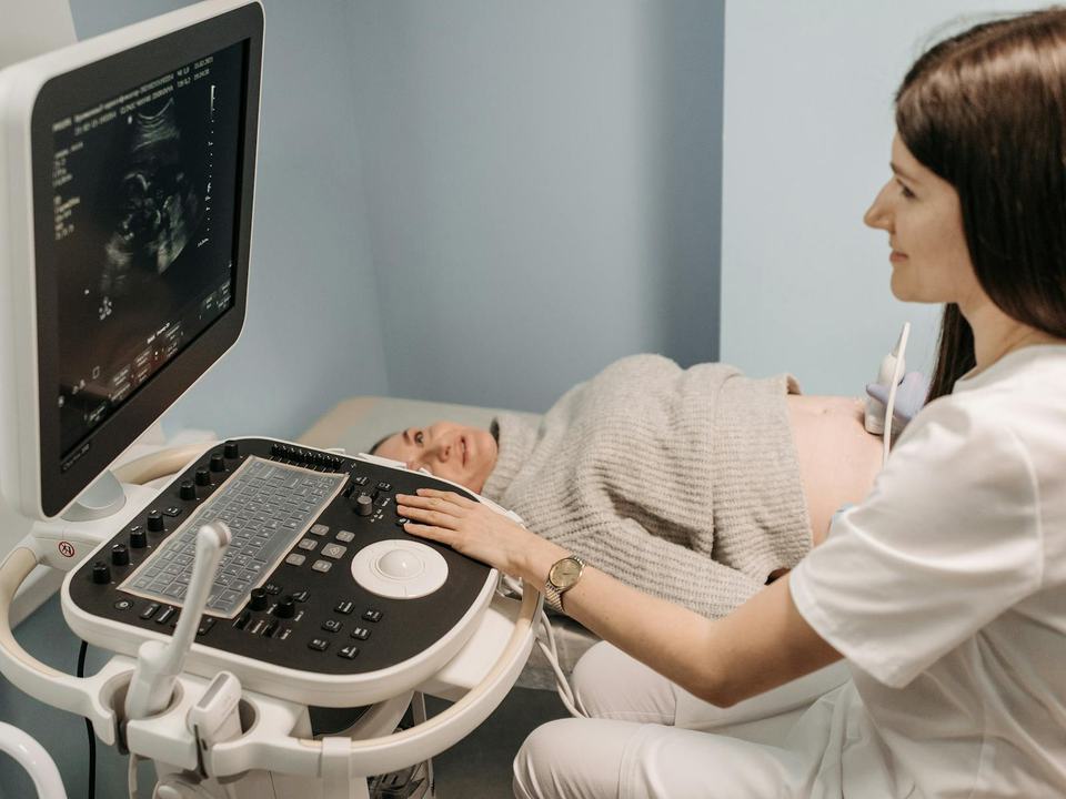 a pregnant woman having an ultrasound