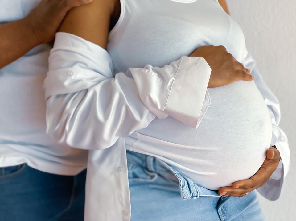 a close up of a pregnant woman