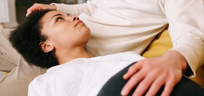 Expectant couple sharing a tender moment with focus on pregnancy and emotional connection.