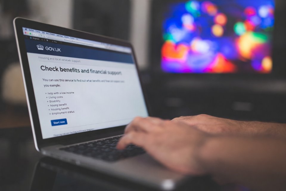 close up of a laptop with user on gov.uk benefits website
