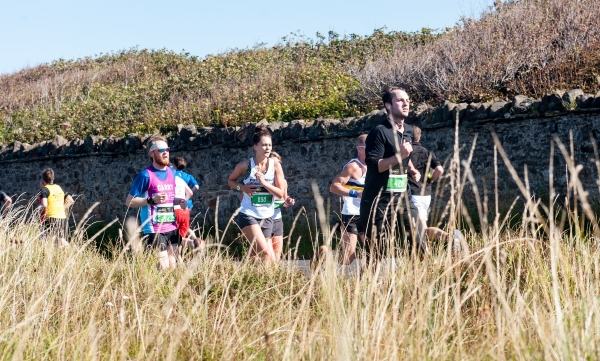 marathon runners running through the countryside