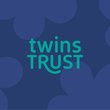 The Twins Trust logo is shown on a dark blue background with lighter blue flower outlines