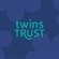 The Twins Trust logo is shown on a dark blue background with lighter blue flower outlines